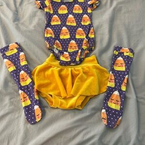 A Classy Chic Boutique Purple and Yellow Bodysuit Set with Candy Corn Charm